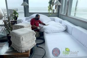 Jorge cleaning white sofa in Westchester, NY - All Clean FiberShield